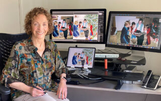 Digital artist Nomi Wagner painting a family portrait with her computers and iPad.